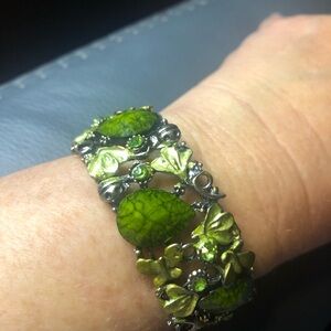 Butterfly accent bracelet with elegant green accents